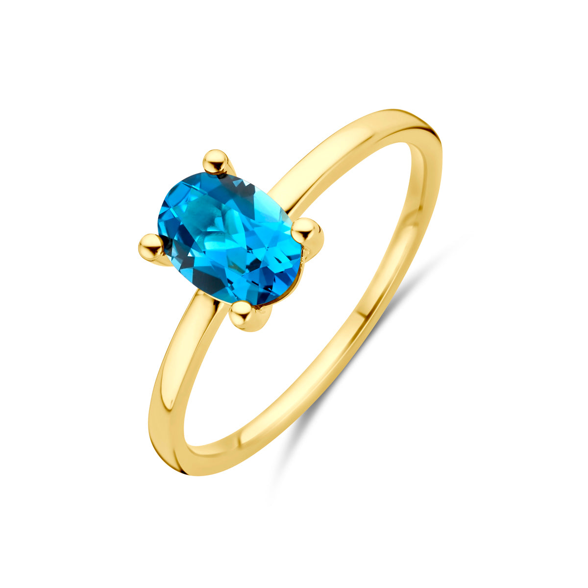 Schuin bovenaanzicht van de gouden ring met london blue topaas van 14 karaat.