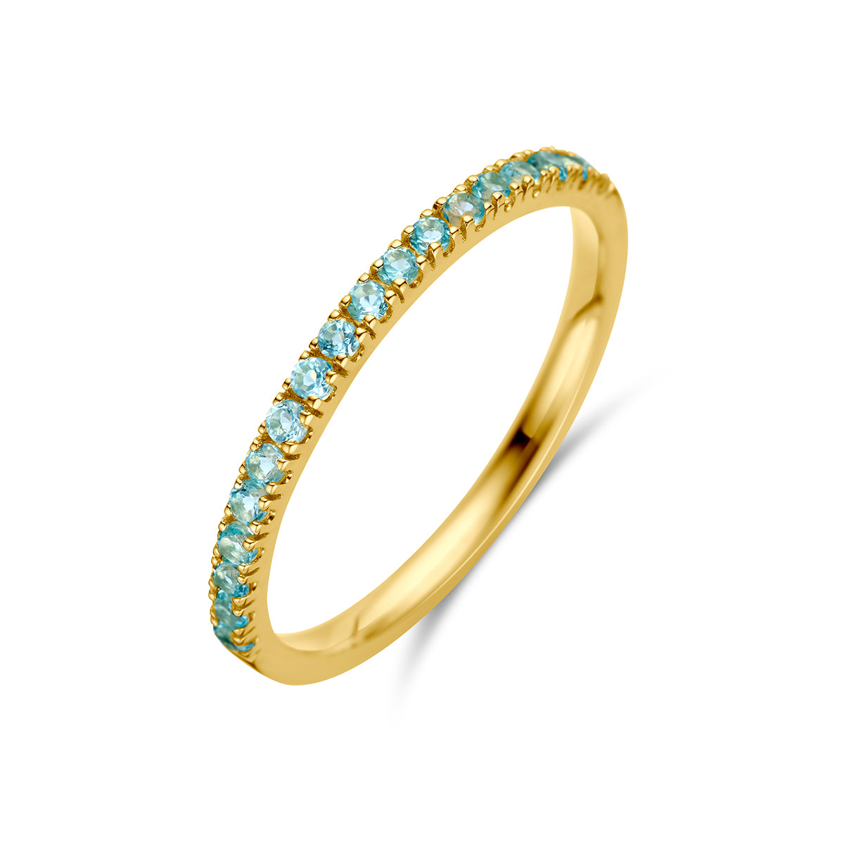 Schuin bovenaanzicht van de gouden geboortesteen ring december met blauwe topaas van 14 karaat.
