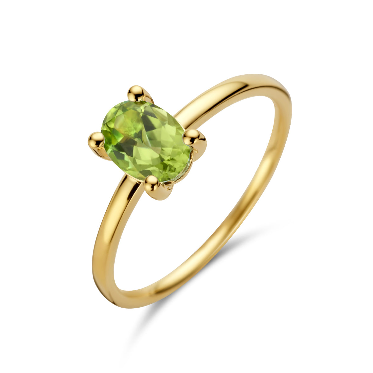 Schuin bovenaanzicht van de gouden ring met peridoot van 14 karaat.