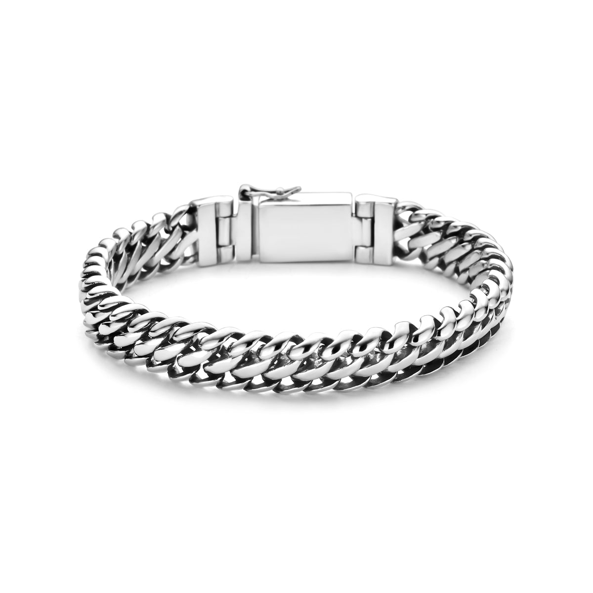 De zware Gravitas zilveren heren armband ligt plat en toont de brede dubbele gourmette schakels.